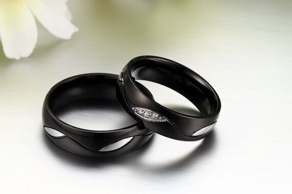 His and her black shop wedding bands