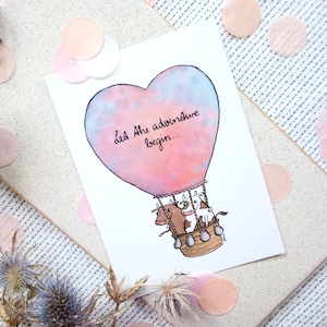 Postkarte A6 Let the adventure begin! Herz-Heißluftballon mit Kühen - Last das Abenteuer beginnen!