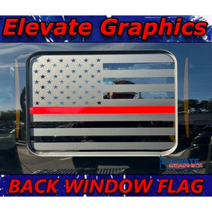 May include: A rectangular back window flag with an American flag design. The flag has a grey and black striped background with blue stars and a red stripe. The text "Elevate Graphics" and "BACK WINDOW FLAG" are visible.
