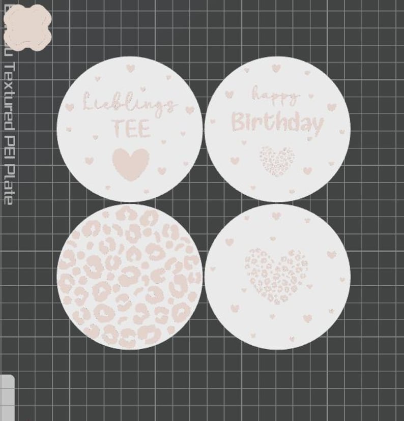 May include: Four round coasters with light pink designs on a white background. One coaster says "Lieblings TEE" with a heart, another says "happy Birthday" with a heart, a third has a leopard print, and the last has a heart design.