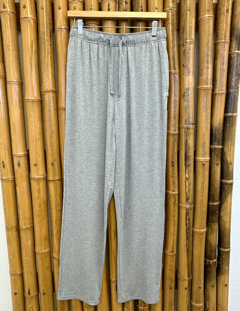 May include: Gray sweatpants with a drawstring waist.
