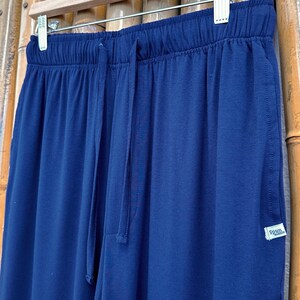 May include: Navy blue sweatpants with a drawstring waist and a small "Spun Bamboo" label on the right side.