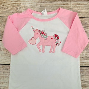 Valentine Unicorn shirt embroidered on a pink sleeve raglan shirt with monogram