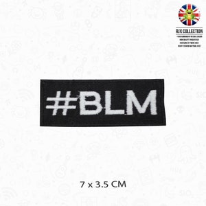 May include: Black embroidered patch with white text that reads "#BLM". The patch is 7 cm by 3.5 cm.