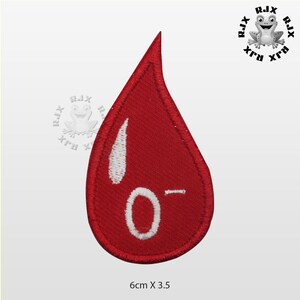 May include: Red blood drop embroidered patch with white outline and the text "O-" inside. The patch is 6 cm by 3.5 cm.