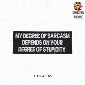 May include: Black and white embroidered iron-on patch with the text "My degree of sarcasm depends on your degree of stupidity". The patch measures 10 cm by 4 cm.