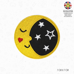 May include: A yellow and black embroidered iron-on patch of a crescent moon with a smiling face and a red heart. The moon is surrounded by five white stars. The patch is 7 cm by 7 cm.