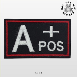 May include: A black embroidered patch with a white 'A+' and 'POS' in a red border. The patch measures 16.5 cm by 10 cm.