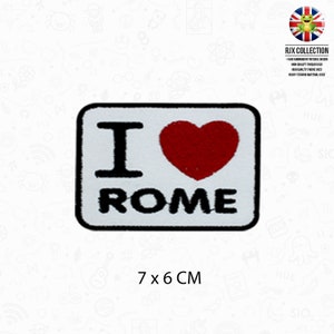 May include: White embroidered patch with black text that says "I love Rome" and a red heart. The patch is 7 cm by 6 cm.