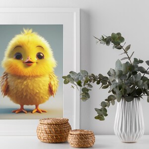 May include: A framed print of a cute cartoon yellow chick with big eyes and a happy expression. The chick is standing on a light blue background. The print is framed in white and is sitting on a white table with two small wicker baskets.