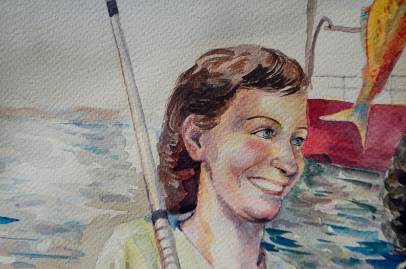 May include: Watercolor painting of a woman with brown hair and blue eyes. She is smiling and wearing a light green shirt. A fishing rod is behind her. The background is a watercolor wash of blue and white.