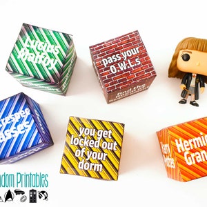 May include: Five colorful dice with different Harry Potter themed phrases. The dice are on a white surface. The phrases on the dice are: "Lucius Malfoy", "Spectrespec Glasses", "You get locked out of your dorm", "Pass your O.W.L.s", and "Hermione Granger".