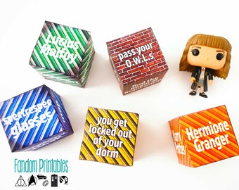 May include: Five colorful dice with different Harry Potter themed phrases. The dice are on a white surface. The phrases on the dice are: "Lucius Malfoy", "Spectrespec Glasses", "You get locked out of your dorm", "Pass your O.W.L.s", and "Hermione Granger".