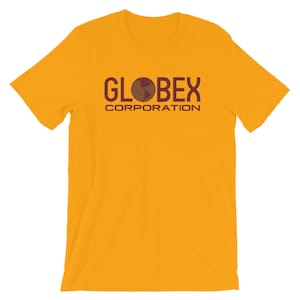 May include: A yellow short-sleeved t-shirt with a maroon graphic of the text "GLOBEX CORPORATION" with a globe icon in the middle of the word "GLOBEX".