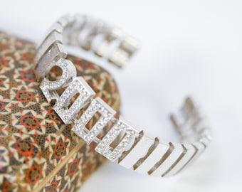 Pulsera plateada texturizada Y2K Joan Rivers 2000