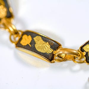 Vintage very dainty Damascene Toledo gold-plated link panel bracelet with safety chain