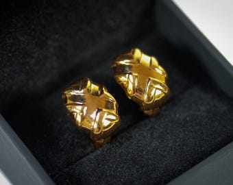 Pendientes de clip esculturales vintage de Nina Ricci en tono dorado