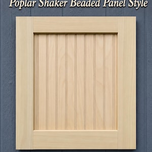 May include: A light-colored wooden cabinet door featuring a Shaker-style frame with a beaded center panel. The text 'Poplar Shaker Beaded Panel Style' is displayed above the door. The wood has a natural, smooth finish with visible grain.