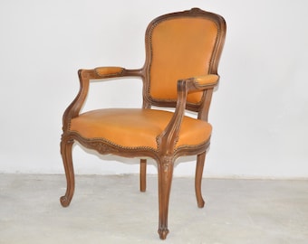 Rococo Yellow Leather Armchair | French Louis XV Cabriolet Carved Rococo Armchair, 1800-1900s | Fauteuil