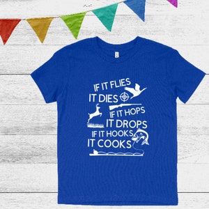 May include: A royal blue t-shirt with a white graphic that reads "If it flies it dies, if it hops it drops, if it hooks it cooks". The graphic includes a bird, a deer, a fish, and a fishing rod.