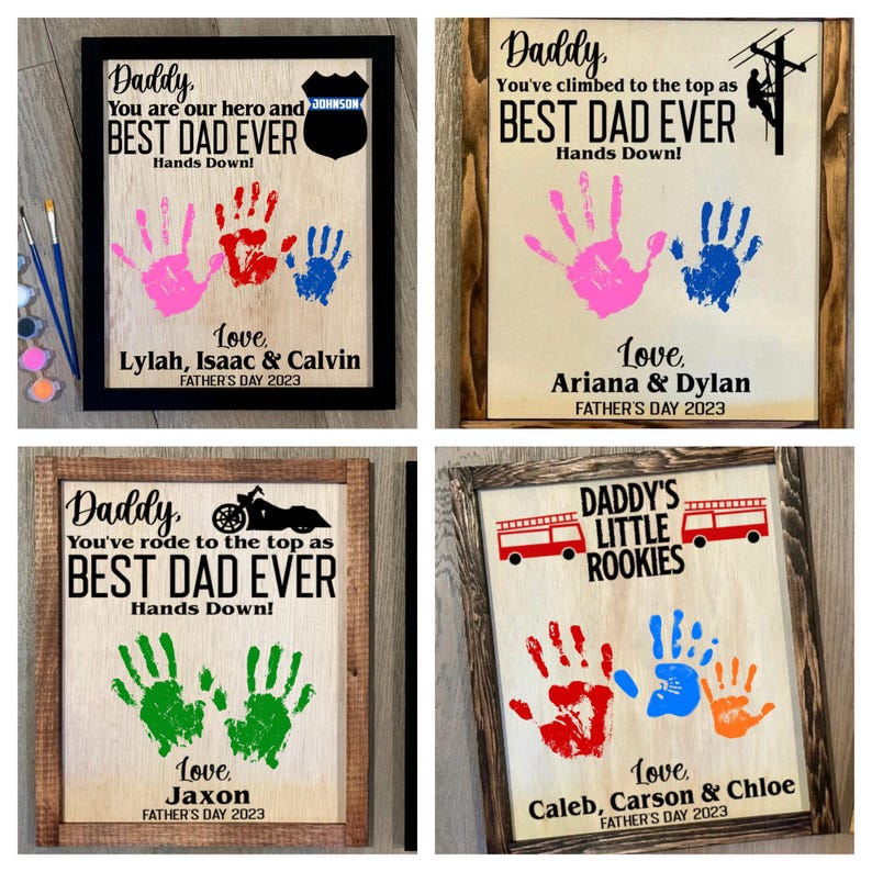 May include: Four framed wood signs with handprint art and text that reads "Daddy, You are our hero and BEST DAD EVER Hands Down! Love, Lylah, Isaac & Calvin Father's Day 2023", "Daddy, You've climbed to the top as BEST DAD EVER Hands Down! Love, Ariana & Dylan Father's Day 2023", "Daddy, You've rode to the top as BEST DAD EVER Hands Down! Love, Jaxon Father's Day 2023", and "DADDY'S LITTLE ROOKIES Love, Caleb, Carson & Chloe Father's Day 2023".