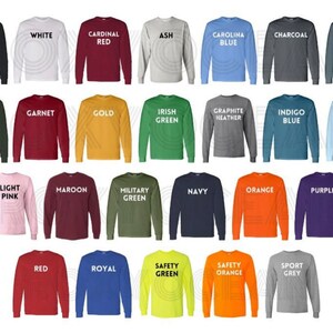 May include: A chart of 24 long-sleeved shirts in various colors, including black, white, red, ash, blue, charcoal, dark heather, forest, garnet, gold, green, graphite heather, indigo blue, light blue, light pink, maroon, military green, navy, orange, purple, royal, safety green, safety orange, and sport grey.