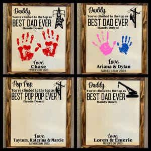 May include: Four framed signs with a Father's Day theme. Each sign features a different job title, such as "Daddy" and "Pop Pop", and includes the text "You've climbed to the top as" followed by the job title and "BEST [Job Title] EVER". Each sign also includes a handprint, a job-related image, and the text "Love [Name(s)]" and "FATHER'S DAY 2023".