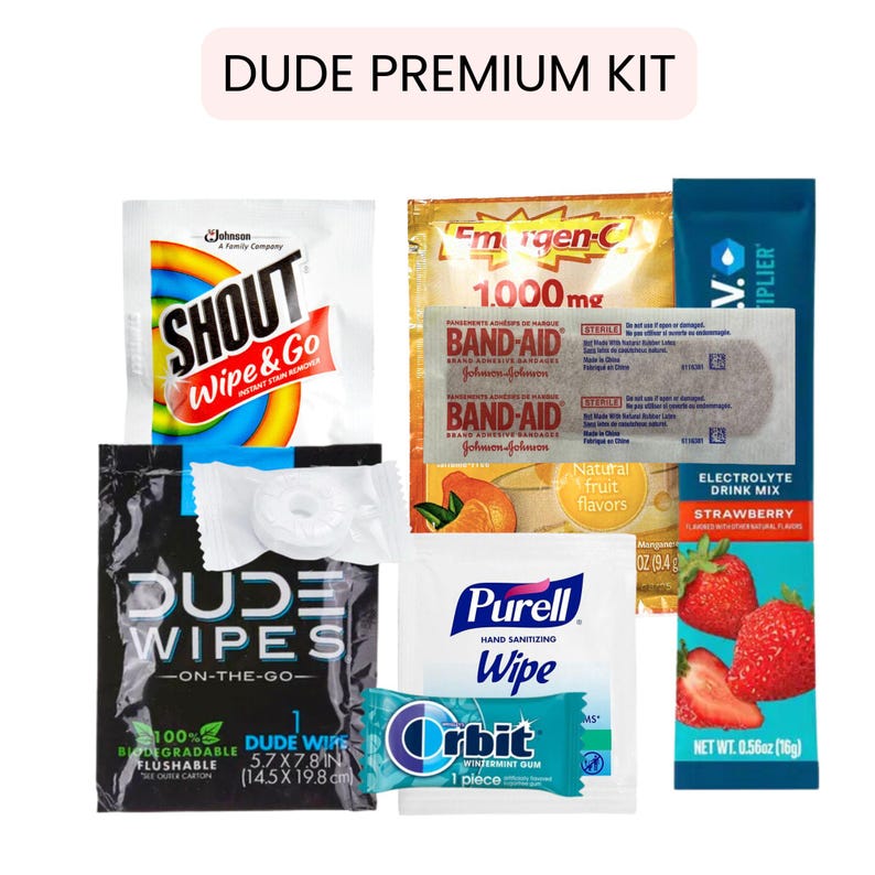 以下が含まれることがあります： Shoutのシミ抜き、Band-Aid、Emergen-C、Dude Wipes、Purellワイプ、Orbitガム、電解質ドリンクミックスなど、パーソナルケアアイテムのコレクション。「DUDE PREMIUM KIT」と表示されています。