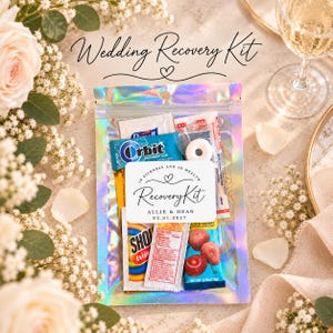 May include: A holographic pouch containing various items including Orbit gum, a white mint, and a cherry-flavoured packet. A white label on the front reads: In Sickness and in Health, Recovery Kit, Allie & Dean, 03.01.2027, with a heart icon.