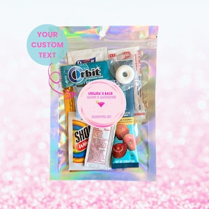 May include: A clear, iridescent zip-lock bag containing small items. A pink circular sticker reads "CHELSEA'S BACH" and "HANGOVER KIT". Other items include gum, mints, and small packets. Text on the bag reads "YOUR CUSTOM TEXT".