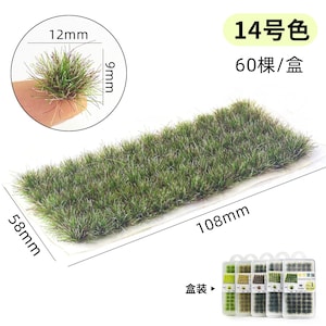 May include: A rectangular patch of green model grass, 108mm long and 58mm wide, with a close-up showing a tuft of grass measuring 12mm by 9mm. The image also includes text in Chinese.