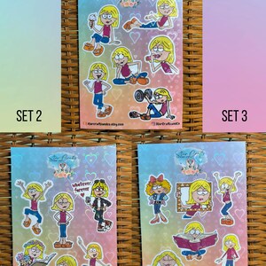 May include: Three sets of stickers featuring a cartoon girl in various poses. The first set shows the girl eating ice cream, exercising, and holding a dumbbell. The second set shows the girl with a book, holding a coffee cup, and doing yoga. The third set shows the girl holding a picture frame, reading a book, and standing with her hands in the air.