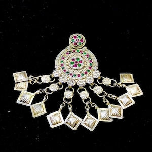 A beautiful hamdmade silver pendant with glass color stone from tribe of multan pakistan