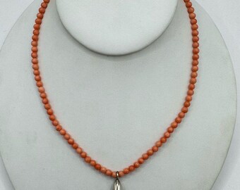 Vintage pink orange coral round beaded necklace  sterling silver charm and hook