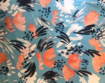 Turquoise viscose jersey with abstract flowers 145 cm wide