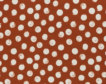 May include: A seamless pattern of white polka dots on a burnt orange background. The dots are hand-painted and have a slightly irregular shape.