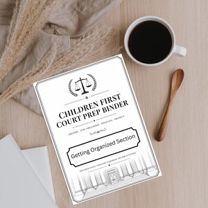 May include: A white binder titled "CHILDREN FIRST COURT PREP BINDER" with the text "Getting Organized Section." The binder is on a light wood surface, next to a cup of coffee and a wooden spoon. Dried plants are in the background.