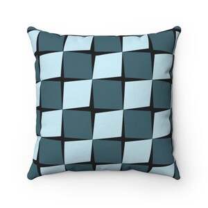 May include: A square patterned throw pillow with a blue and light blue geometric design.