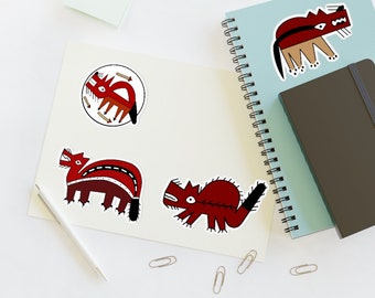 May include: Four red and black stylized animal stickers on a white background. The stickers are of a wolf, a bear, a fox, and a deer. The stickers are all in a similar style, with black outlines and red and black details.