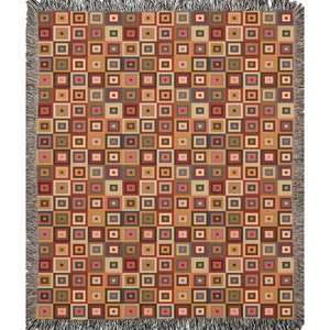May include: A woven throw blanket with a geometric pattern of squares in shades of brown, red, orange, beige, and blue.
