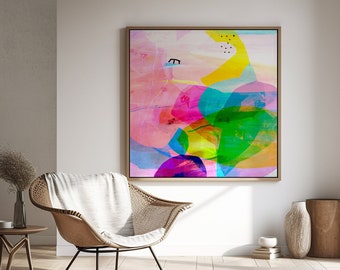 May include: Abstract art painting with a mix of pink, yellow, green, blue, and purple colors. The painting is framed in a light wood frame and is hanging on a white wall.