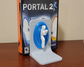 Sujetalibros con temática de Portal para libros, juegos y películas.