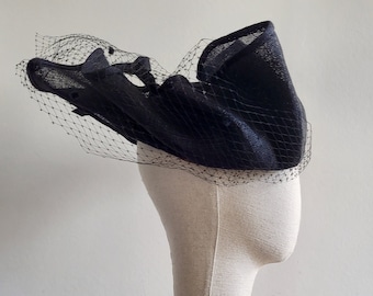 Statement headpiece made of black sinamay