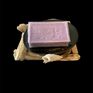 Driftwood soap dish decorated with a shell and black cup