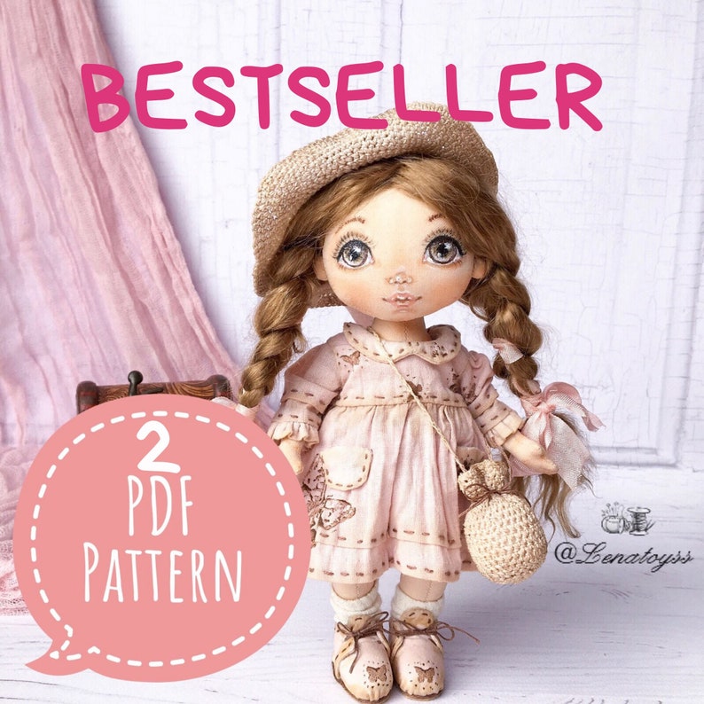 May include: A pink and white doll with brown hair in braids wearing a straw hat and a pink dress. The doll is holding a crocheted bag. The image includes the text "BESTSELLER" and "2 PDF PATTERN".