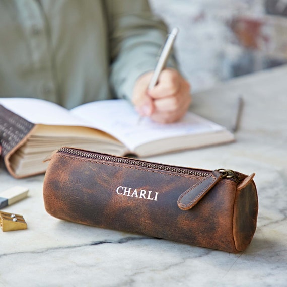 Petit trousse ronde pour l'école avec fermeture éclair