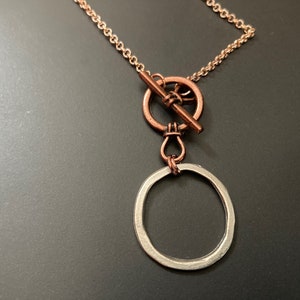 Modern glasses chain with toggle fastening at the front with silver and rose gold in organic shapes, copper hoop, artisan jewellery