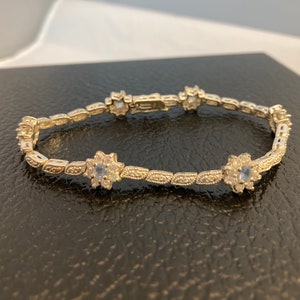 Blue Topaz and CZ Sterling Silver Tennis Bracelet