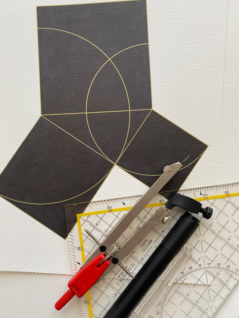 May include: A black and white protractor, a black compass, and a black ruler with yellow markings. The compass is open and the ruler is partially visible. The protractor is on top of the compass and ruler. The protractor has a black and white grid pattern with numbers from 10 to 150. The compass has a black handle and a silver metal arm. The ruler has a black handle and a silver metal arm. The ruler has a yellow scale with numbers from 10 to 150.