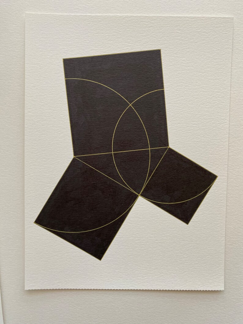 May include: A black geometric shape with gold lines. The shape is made up of three squares that are connected at the corners. The squares are arranged in a way that creates a three-dimensional effect.